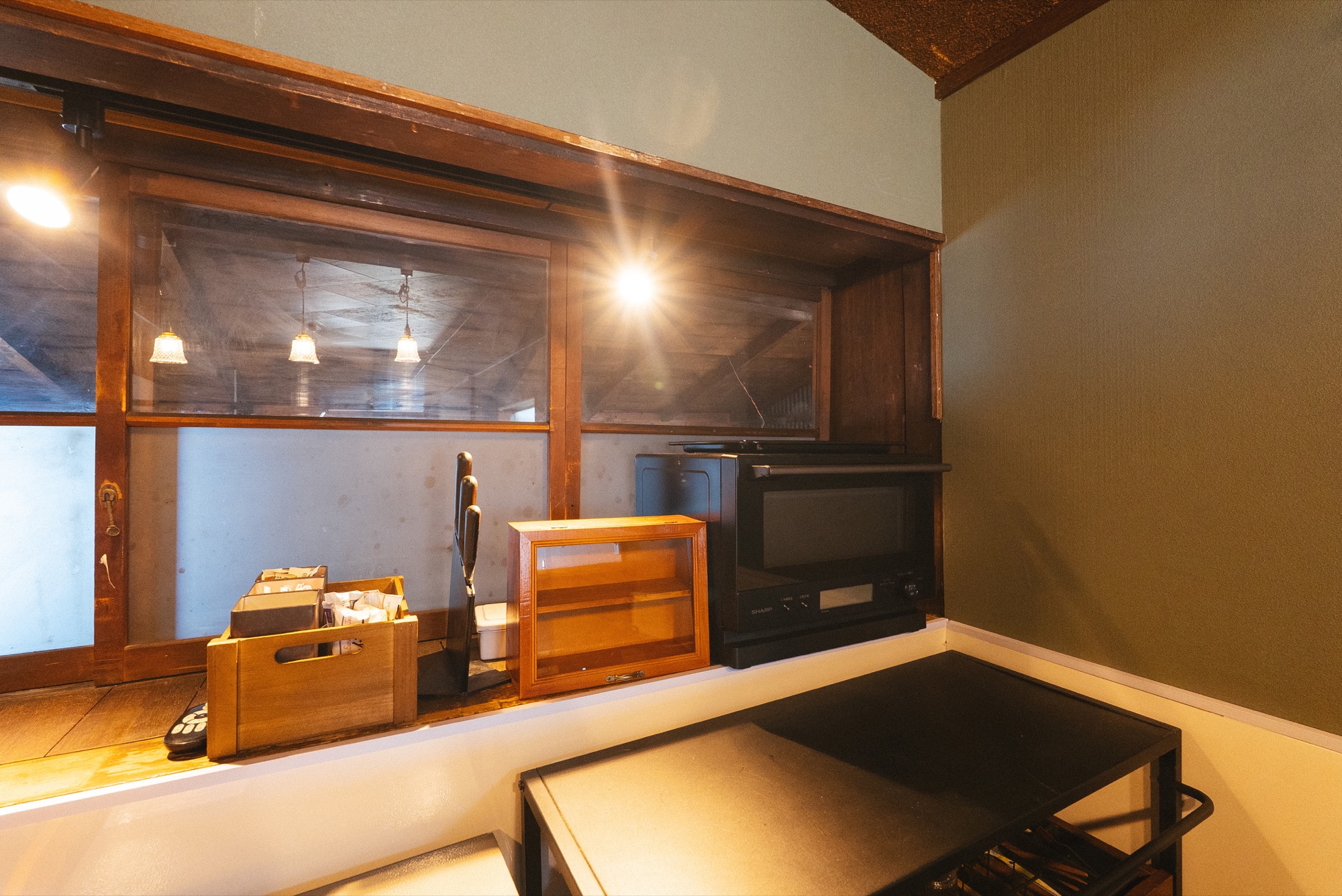 Kitchen nook with microwave and shelves